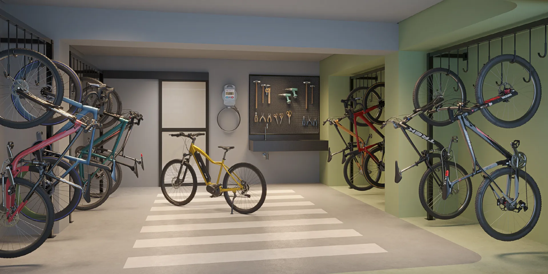 Bicicletário com ganchos de parede, bancada de ferramentas e tomada para bike elétrica