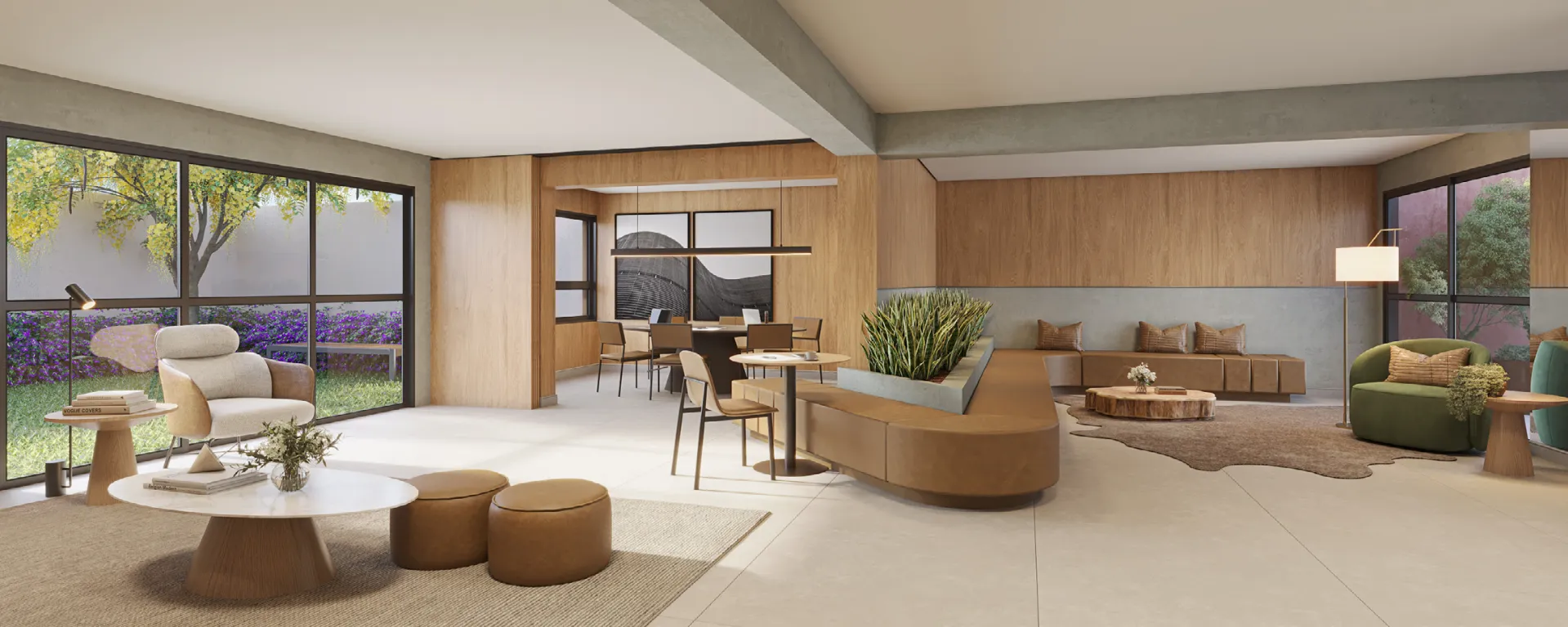 Coworking integrado ao lounge, com mesas de trabalho e vista para jardim